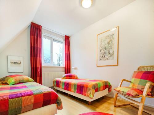 Ένα ή περισσότερα κρεβάτια σε δωμάτιο στο Homely Apartment in Noordwolde with Balcony