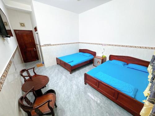 Ένα ή περισσότερα κρεβάτια σε δωμάτιο στο nhà nghỉ thanh thuy 2