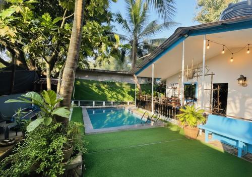an image of a house with a swimming pool at The Plix Villa, Vagator in Anjuna