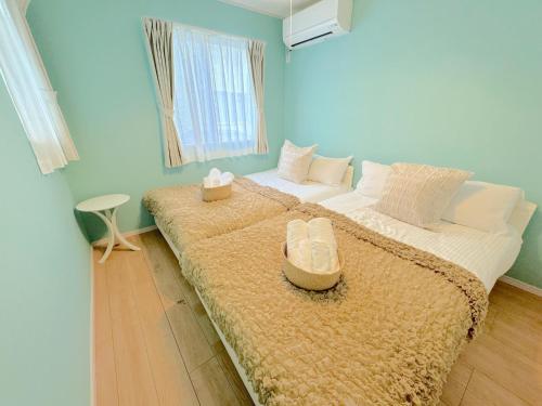 Postel nebo postele na pokoji v ubytování THE FEEL ONNA 2 / Vacation STAY 18789