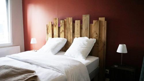 Ένα ή περισσότερα κρεβάτια σε δωμάτιο στο Le Chai des Poilanes