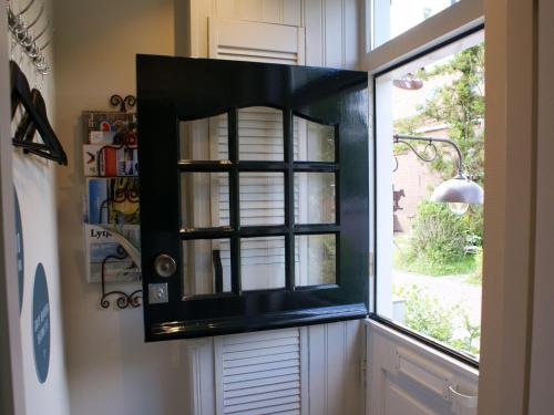 Kuchyň nebo kuchyňský kout v ubytování Atmospheric Wadden houses located next to each other near the Wadden Sea