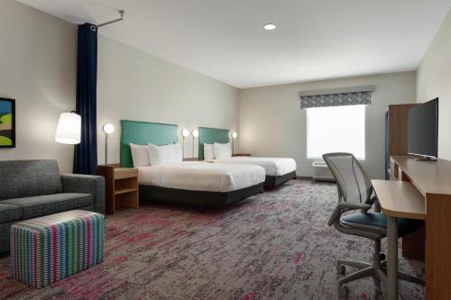 Postel nebo postele na pokoji v ubytování Home2 Suites By Hilton Denton