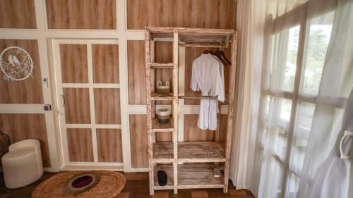 a room with a ladder in the corner of a room at The River Island Sidemen in Sidemen