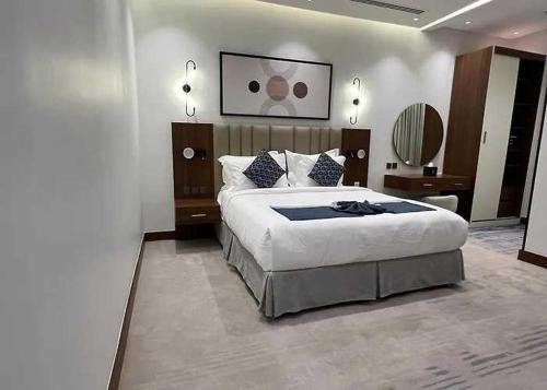 a bedroom with a large bed in a room at Sunday Luxury Central formerly Anan hotel in Riyadh