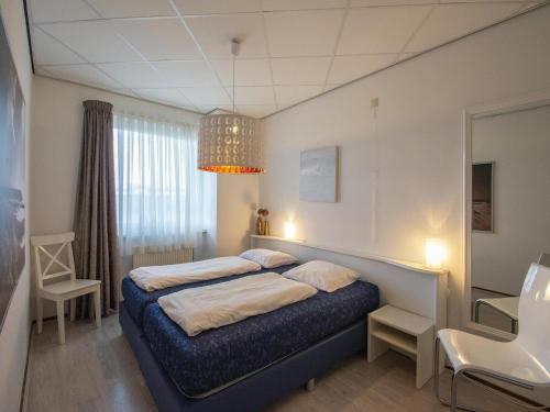 Ένα ή περισσότερα κρεβάτια σε δωμάτιο στο Gorgeous seaside apartment