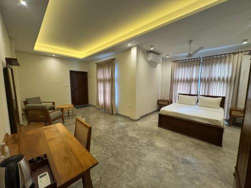 Ένα ή περισσότερα κρεβάτια σε δωμάτιο στο Kirala House - Unawatuna