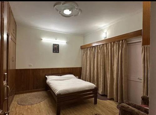 Voodi või voodid majutusasutuse Mountain Retreat Nainital toas