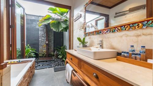 Koupelna v ubytování Umah Sunset