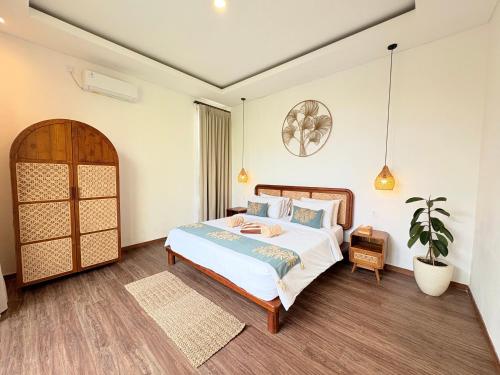 Ένα ή περισσότερα κρεβάτια σε δωμάτιο στο Nairi Villa Ungasan