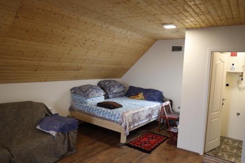 Ένα ή περισσότερα κρεβάτια σε δωμάτιο στο Vila Dinara