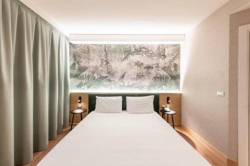 Ένα ή περισσότερα κρεβάτια σε δωμάτιο στο Neo Hotel