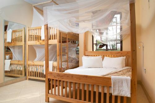 Postel nebo postele na pokoji v ubytování White House of Zanzibar