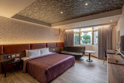 Postel nebo postele na pokoji v ubytování King & Princess Motel - Rende