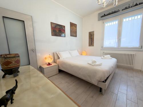 a bedroom with a bed and a black dog in it at Quiet Home in Val Brona in Valbrona