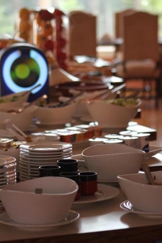 a table with bowls and plates of food on it at Hotel Idou Tiznit in Tiznit