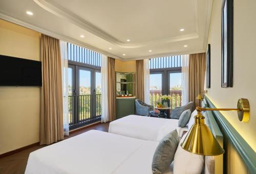 Ένα ή περισσότερα κρεβάτια σε δωμάτιο στο Lumiere Boutique Vỹ Dạ