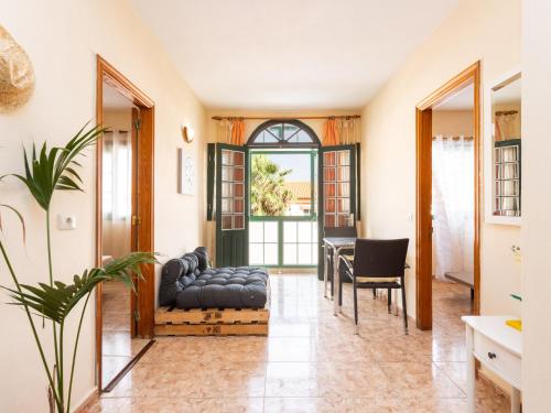 a living room with a couch and a table at Live Salinas 3 in Caleta de Interián