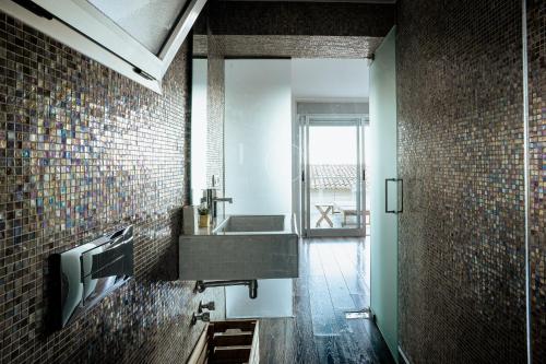 a bathroom with a sink and a mirror at Moonkey - Casa El Cabo in Balcon del Mar