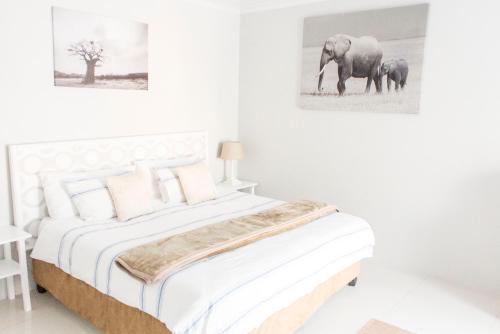 Postel nebo postele na pokoji v ubytování Julinas Guesthouse