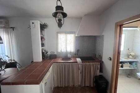 a kitchen with a counter top in a room at Casa Abades Arcos de la Frontera in Arcos de la Frontera