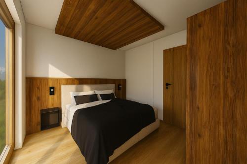 a bedroom with a large bed and a wooden ceiling at PUREALPS Apartment - Opening December 2025 in Schwendberg