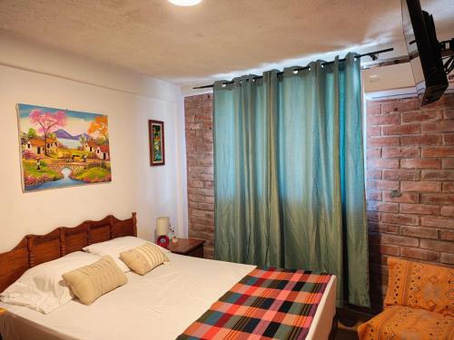 Ένα ή περισσότερα κρεβάτια σε δωμάτιο στο Lombardia