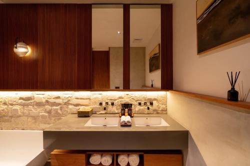 a bathroom with two sinks and a large mirror at Sawo Villa Canggu - Private Brand New 2BR Villa in Canggu