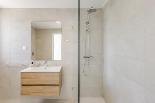 a bathroom with a sink and a shower at Vale Furado Sea & Nature - BY SCH - B in Vale Furado