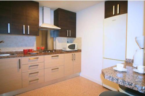 Kuchyň nebo kuchyňský kout v ubytování Mogador beach - HOME RENT MALAGA