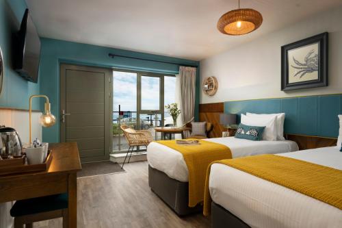 Postel nebo postele na pokoji v ubytování The Old Success Inn