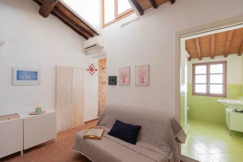 a bedroom with a bed and a sink at Appartamento Piazzetta 5 by ElbaSummer in Portoferraio