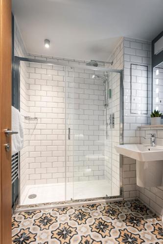 a bathroom with a shower and a sink at The Old Success Inn in Sennen Cove