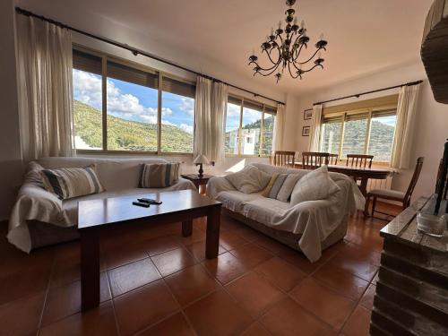 a living room with a couch and a table at Casa Rural El Olivo in Alatoz
