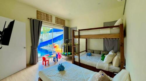 En eller flere senge i et værelse på Tabi Bito Poolvilla ทาบิ บิโตะ