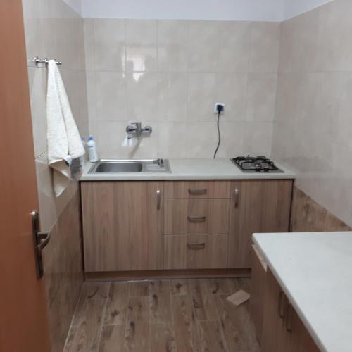 a kitchen with a sink and a stove at Joanna in Krasnobród