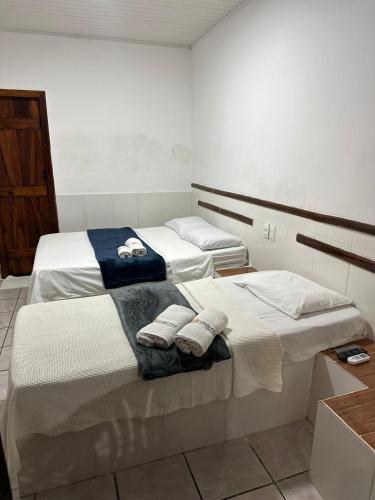 Ένα ή περισσότερα κρεβάτια σε δωμάτιο στο Pousada Costa Azul