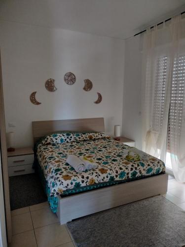 Ένα ή περισσότερα κρεβάτια σε δωμάτιο στο Vista mare a Sanremo