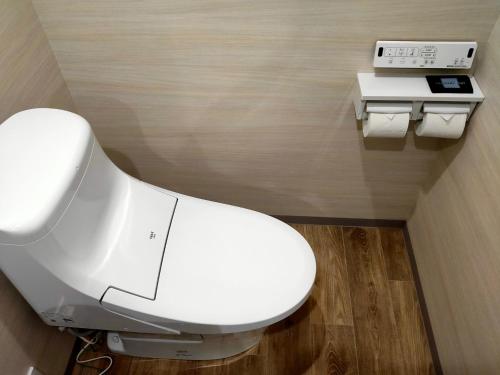 a bathroom with a white toilet in a room at HOTEL ERENOA - Vacation STAY 61067v in Nagoya