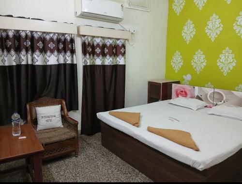 Ένα ή περισσότερα κρεβάτια σε δωμάτιο στο International Guest House