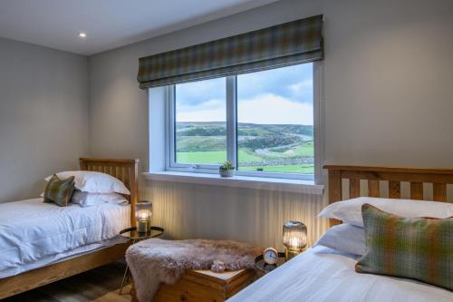 Postel nebo postele na pokoji v ubytování Armadale Farm Cottage