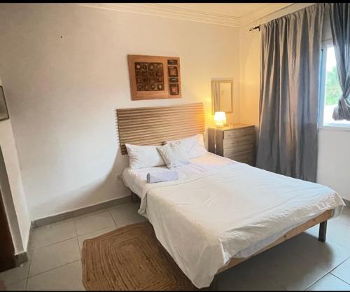 Katil atau katil-katil dalam bilik di Cozy Apartment