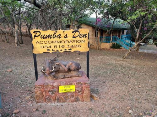 a sign for a park with an elephant statue at Pumba's Den Kranspoort in Winterkamp