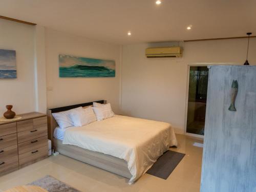 Ένα ή περισσότερα κρεβάτια σε δωμάτιο στο Bamboo House