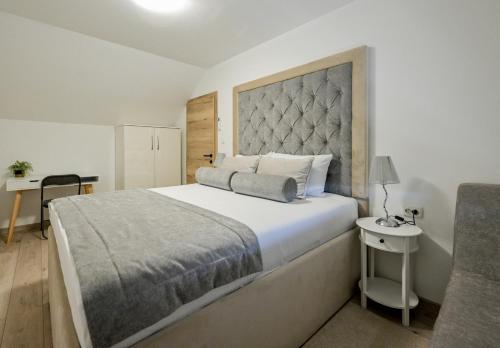 Postel nebo postele na pokoji v ubytování Kuća za odmor Olympus