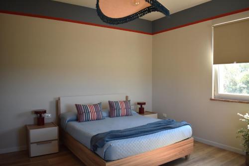 Postel nebo postele na pokoji v ubytování Podere Centoquattro - Appartamento "Il Blu"