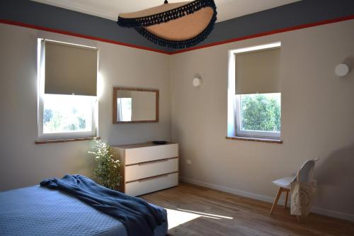 Postel nebo postele na pokoji v ubytování Podere Centoquattro - Appartamento "Il Blu"