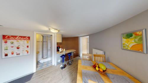a living room with a table with fruit on it at Ferienwohnung Silo Mit Kleinem Garten in Poppendorf