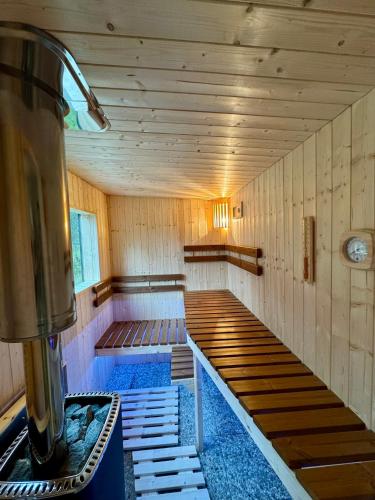 a empty room with a bench in a boiler room at Tiny house Malý gurmán in Rohozná