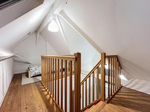 En eller flere senge i et værelse på Duplex de la place de Bergues